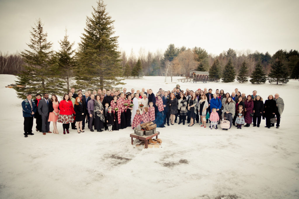 Group photo of guests at a winter wedding